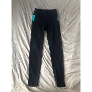 Black athletic leggings with mesh side panel